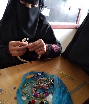 Woman making jewelry