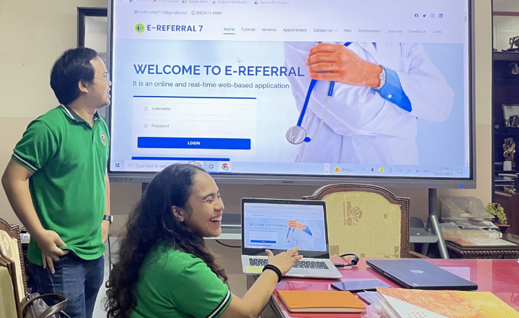  Cebu Department of Health staff demonstrating a digitized e-referral system on a screen and laptop