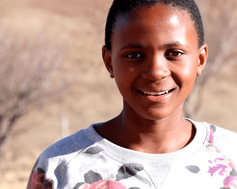 Girl in Lesotho A smiling adolescent girl