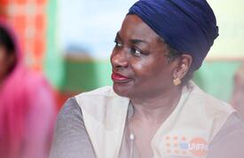 A close up of Dr. Natalia Kanem on the right side with a woman sitting on her left.