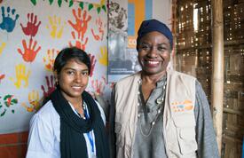 Dr. Natalia Kanem standing next to a midwife at a women-friendly space in Kutupalong settlement, Bangladesh.
