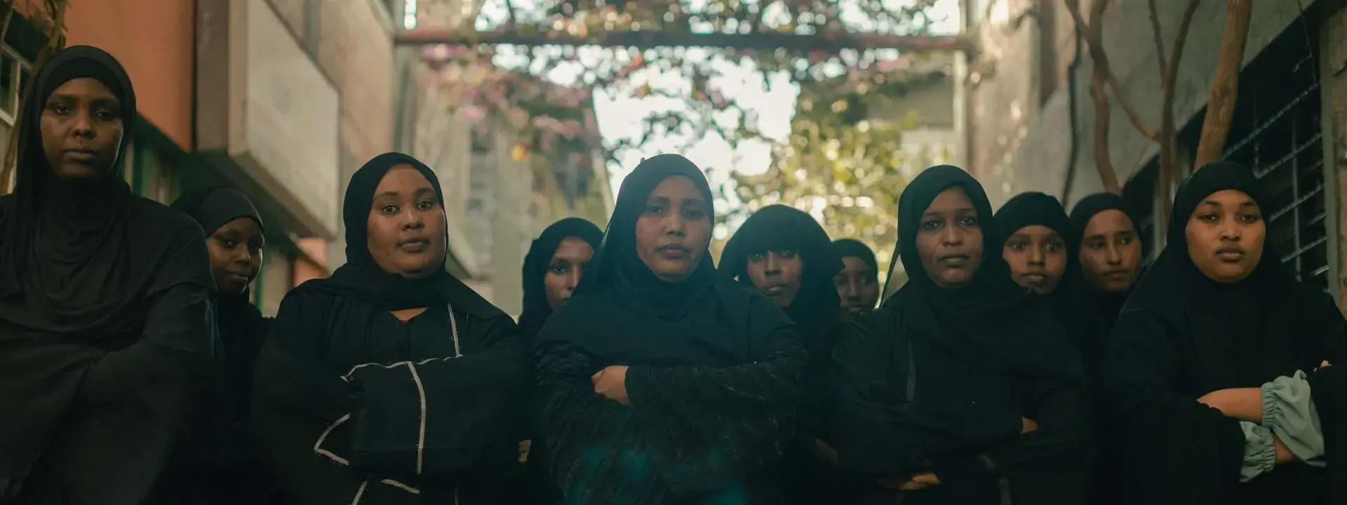 Eleven women dressed in black 