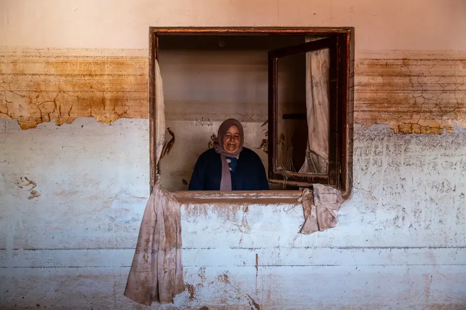 A woman in a flood-damaged home in Gandula, Libya. © Moises Saman/Magnum Photos/UNFPA
